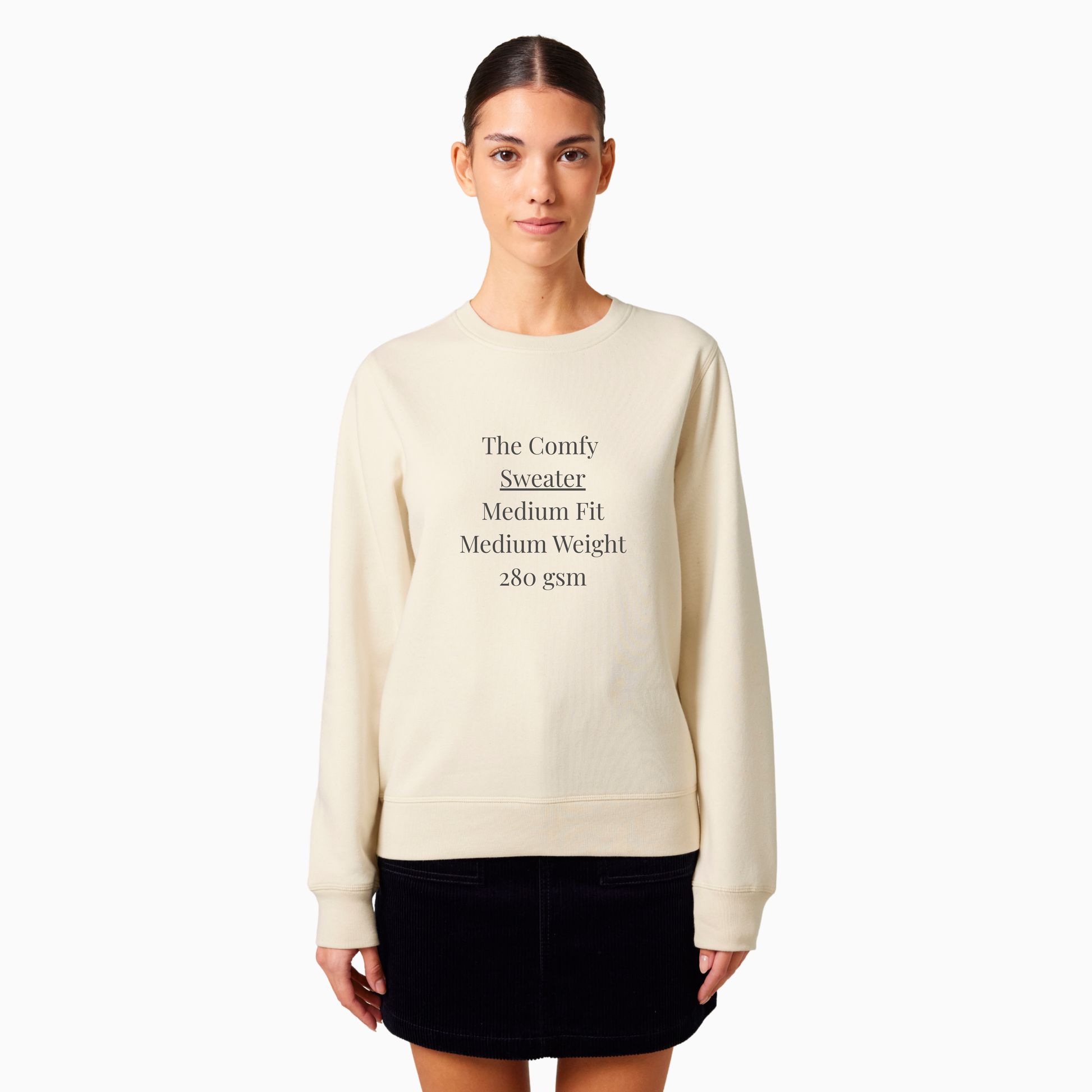 Person wearing a light creme sweater and black skirt on a white background - front is showing